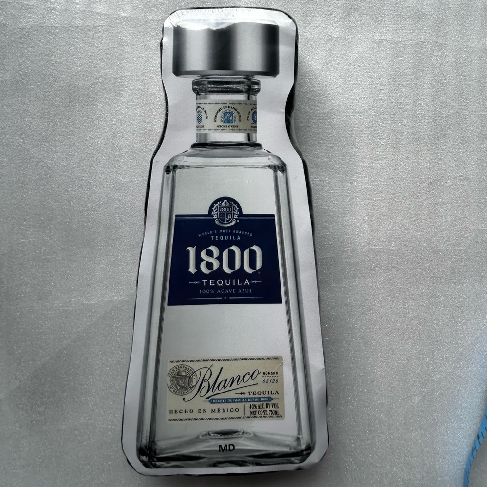 1800 Tequila Blanco Medium T-Shirt in Compressed Shape of Bottle Shrink Wrapped